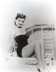 Debra Paget seated on a bench - Vintage Photo Print
