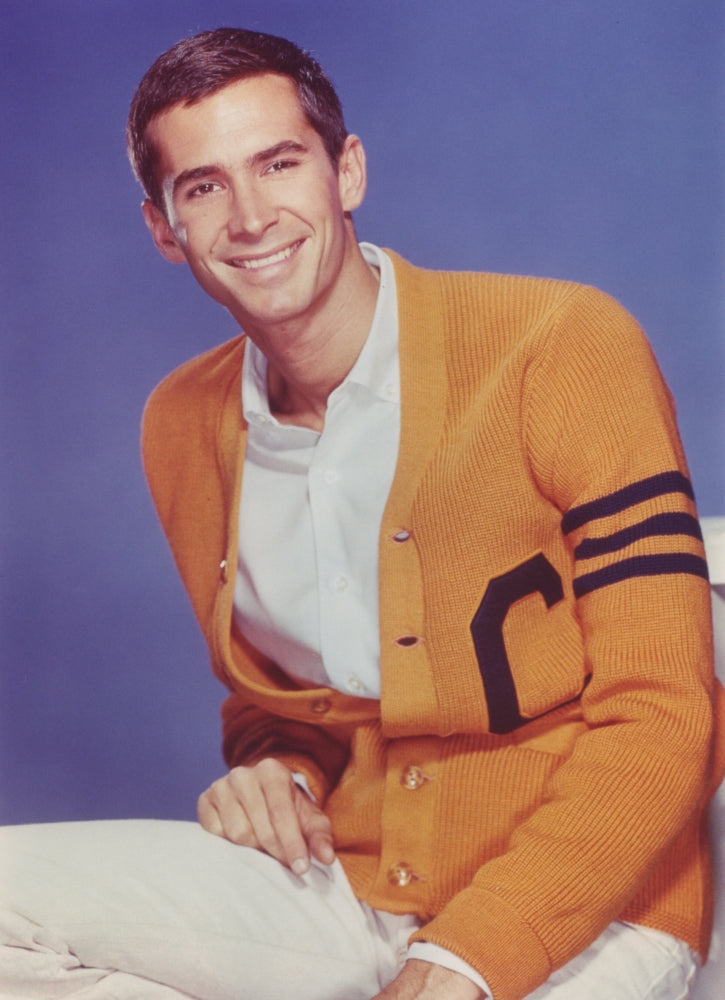 Anthony Perkins in a yellow coat photo print showcasing classic cinema.