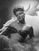 Ginger Rogers lying on bed black and white photo print.