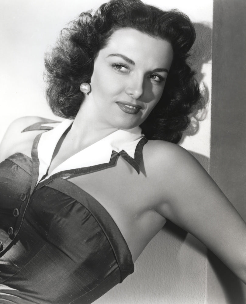 Jane Russell posed in black linen shoulder dress with white collar photo print.
