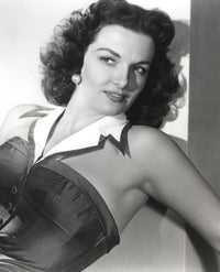 Jane Russell posed in black linen shoulder dress with white collar photo print.