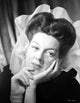 Rosalind Russell Leaning on Hand Photo Print showcasing classic Hollywood style.