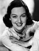 Rosalind Russell smiling in a classic photo print.