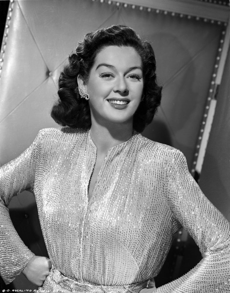 Rosalind Russell smiling with hands on hips photo print