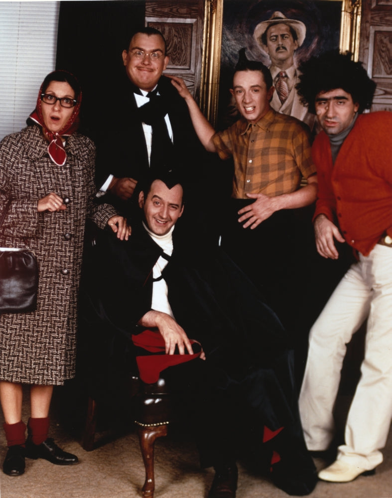 John Candy wearing a formal outfit in a group portrait photo print.