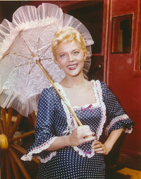 Peggy Castle holding an umbrella in a dotted dress photo print