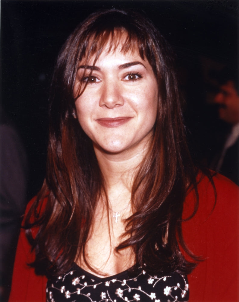 Close-up portrait photo print of Nadia Dajani on a black background.