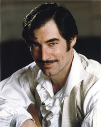 Timothy Dalton close-up portrait photo print on black background.