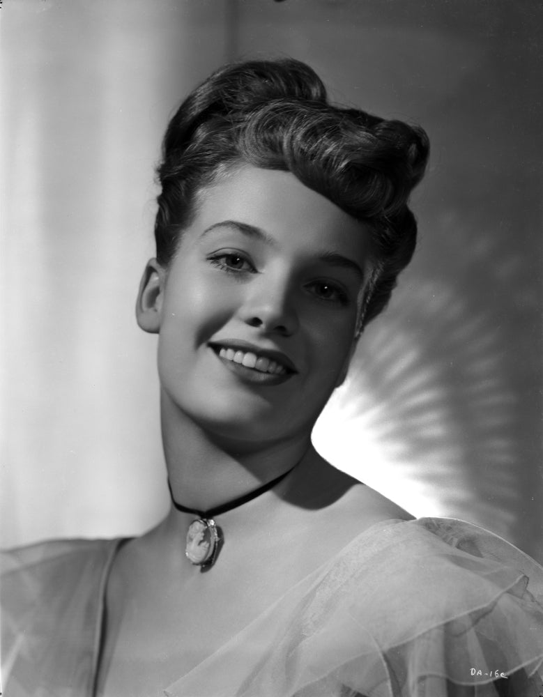 Debra Alden smiling photo print, available in various sizes.