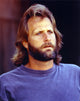 Close-up portrait photo print of Jeff Daniels in a blue shirt on a black background.