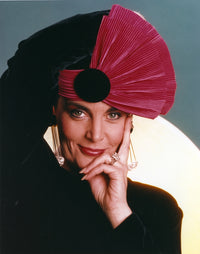 Close-up portrait photo print of Linda Dano wearing a fan hat.