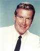 Ken Clarke portrait photo print in white formal outfit.
