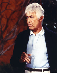 James Coburn Posed in Black Coat Photo Print