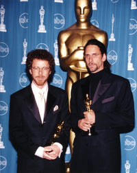 Coen Brothers holding trophy in black tuxedo photo print.