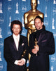 Coen Brothers holding trophy in black tuxedo photo print.