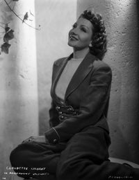 Claudette Colbert classic portrait photo print in sitting pose.