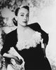 Joan Crawford leaning in a blouse photo print, vintage Hollywood elegance.