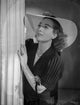 Joan Crawford classic portrait photo print wearing a V-neck blouse and hat.