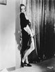 Joan Crawford leaning against a wall photo print, classic Hollywood decor.