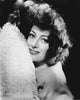 Joan Crawford lying on a bed photo print, classic Hollywood image.