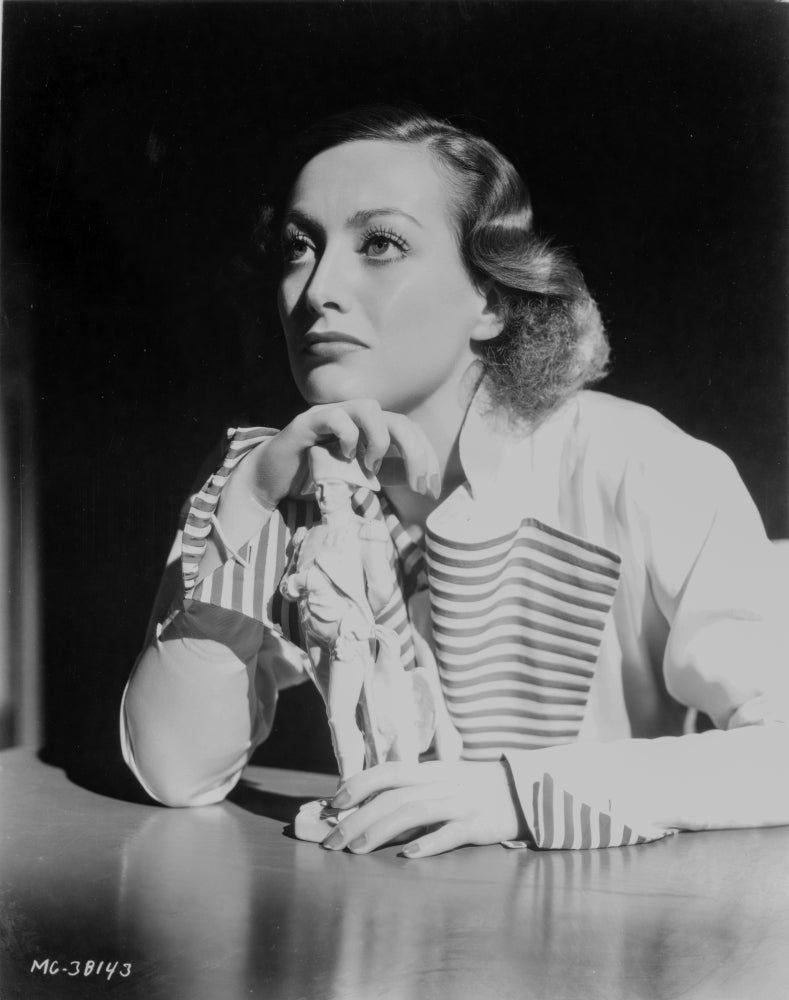 Joan Crawford leaning on a table photo print