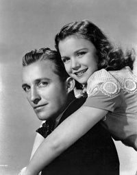 Bing Crosby with a girl photo print, capturing a nostalgic moment in classic Hollywood.
