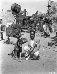 Douglas Fairbanks Jr. on a film set with dog - Photo Print