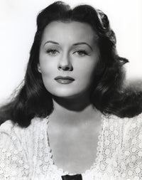 Rhonda Fleming posed in a white blouse photo print, classic Hollywood style.