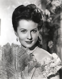 Rhonda Fleming holding a feather fan photo print