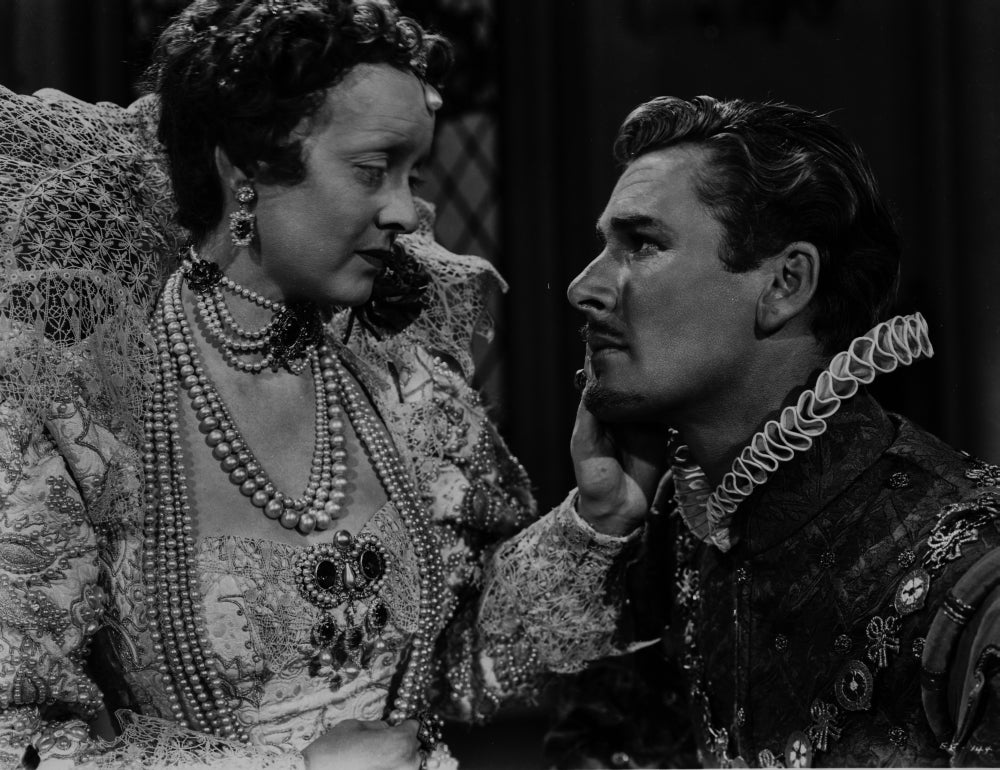 Errol Flynn film still photo print capturing classic Hollywood charm.