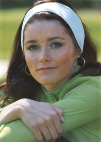 Margot Kidder in green sweater with white headband photo print.