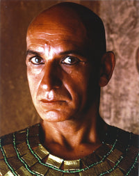 Close up portrait of Ben Kingsley in a gold Egyptian outfit photo print