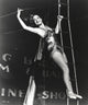 Dorothy Lamour climbing the trapeze in a vintage circus photo print.