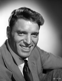 Burt Lancaster wearing a suit in a squat pose photo print