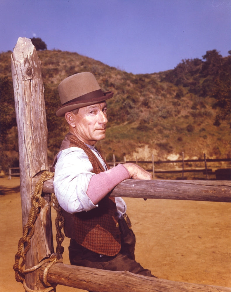 Laramie Cast Cowboy Outfit Photo Print featuring the cast leaning on wood.