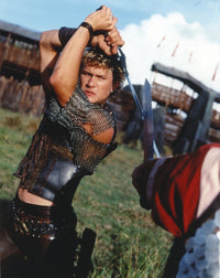 Heath Ledger wearing a vest with a sword in a fighting scene photo print.