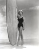 Janet Leigh in a black swimsuit touching a surfing board photo print.