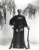 Janet Leigh wearing a corset and holding a rifle photo print.