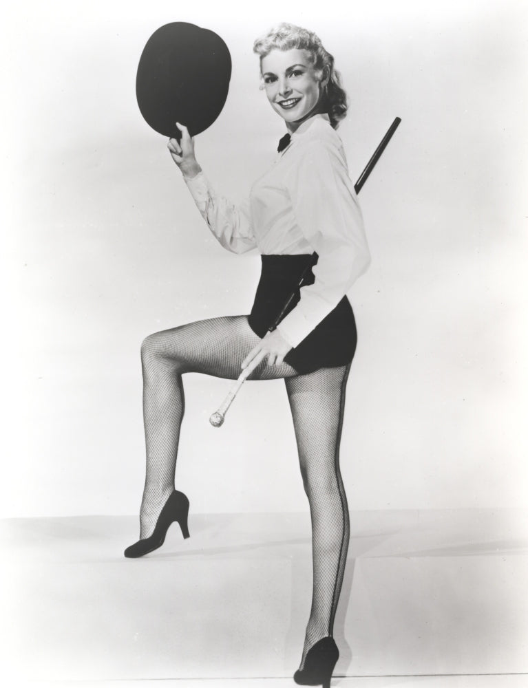 Janet Leigh in elegant white silk bodice holding a black hat photo print.