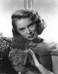 Janet Leigh close up portrait in black sheer dress with silver necklace