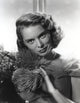 Janet Leigh close up portrait in black sheer dress with silver necklace