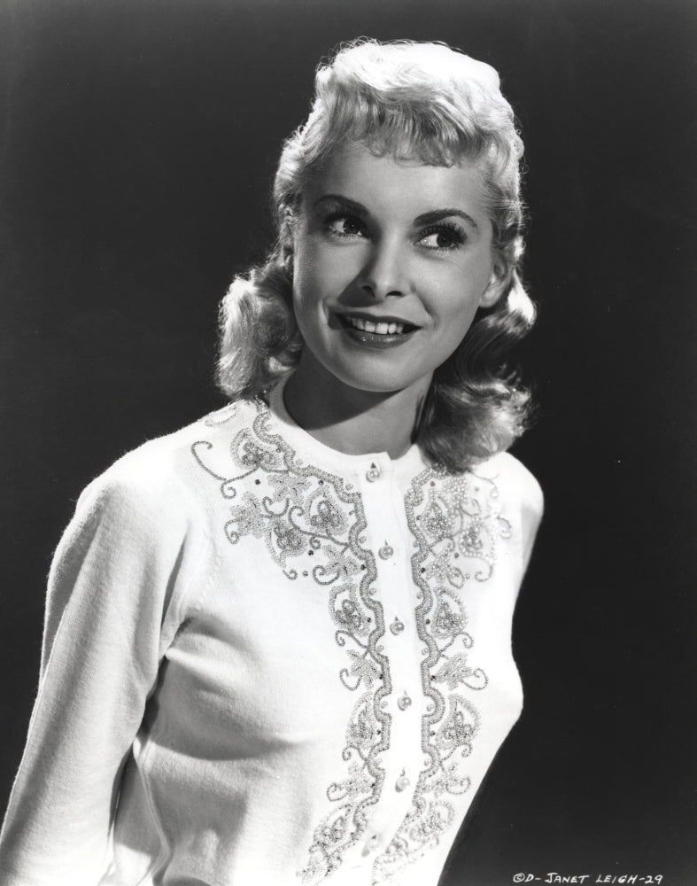 Janet Leigh in a white embroidered long sleeve cotton smock photo print on black background.