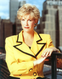 Joan Lunden in a yellow suit photo print, vibrant and stylish.