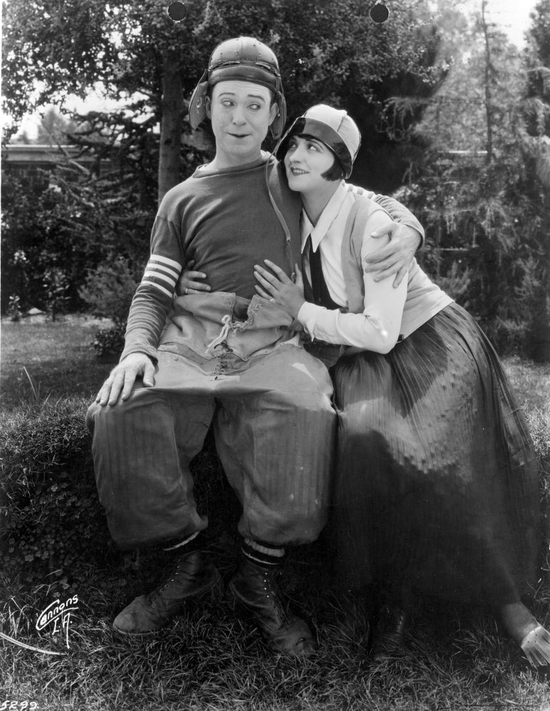 Harry Langdon Couple Scene Movie Photo Print showcasing classic cinema charm.