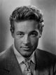 A Portrait Of Guy Madison Photo Print showcasing classic Hollywood charm.
