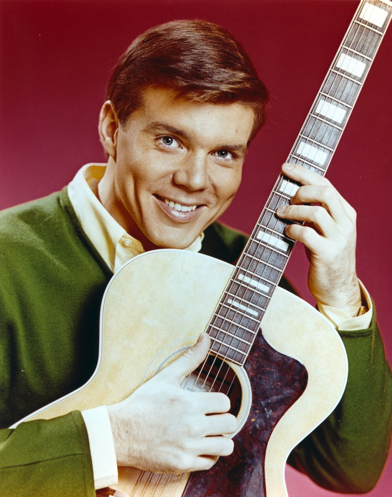 Close up portrait photo print of John Davidson with guitar.