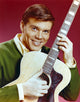 Close up portrait photo print of John Davidson with guitar.