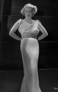 Bette Davis posed in an elegant white dress photo print