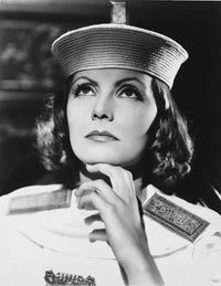 Close-up portrait photo print of Greta Garbo in a police outfit.