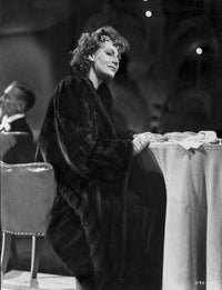Greta Garbo classic photo print in a dark dress, vintage portrait.